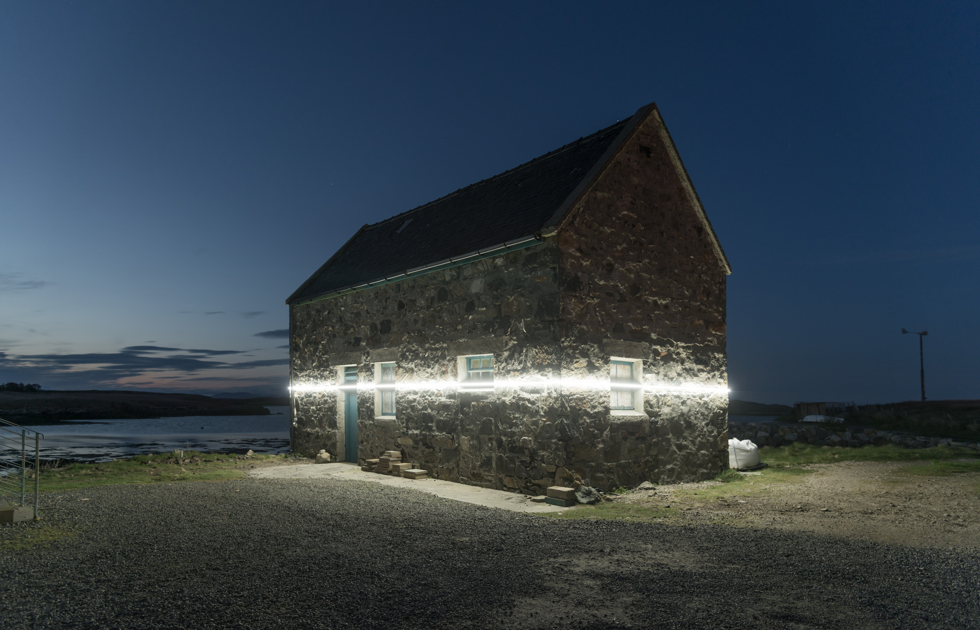 Light Installation Shows Future Water Lines Against Existing Structures   Light Line Water Level 